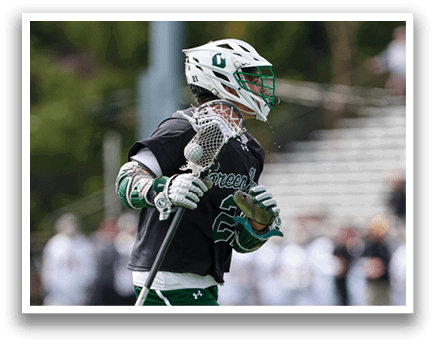A man wearing a green and black uniform with the number 56 on it. Description generated by AI