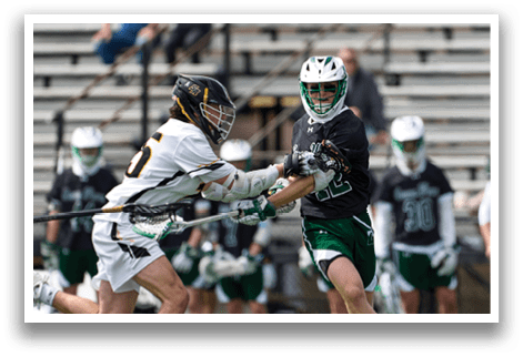 A group of people playing a game of lacrosse. Description generated by AI