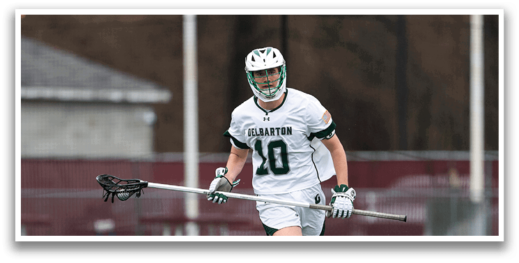 A man in a white and green uniform is running on a field. Description generated by AI