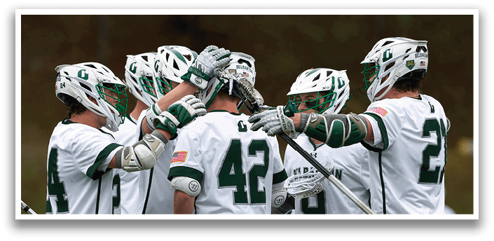 A group of men wearing white uniforms and green and white helmets. Description generated by AI