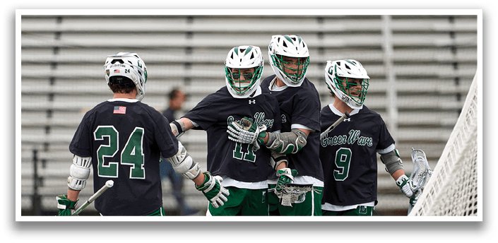 Three men playing lacrosse. Description generated by AI