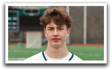 A young man wearing a white and green jersey with the number 11 on it. Description generated by AI
