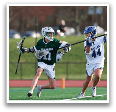 A man in a green and white uniform is running with a stick in his hand. Description generated by AI