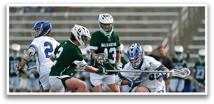 A group of people playing a game of lacrosse. Description generated by AI