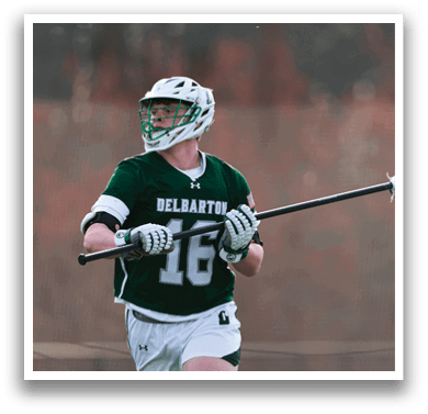 A man wearing a green and white uniform with the number 16 on the back of his jersey. Description generated by AI