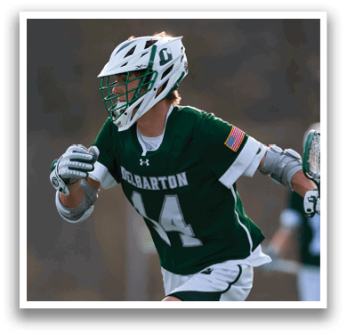 A man wearing a green and white shirt with the number 14 on it. Description generated by AI