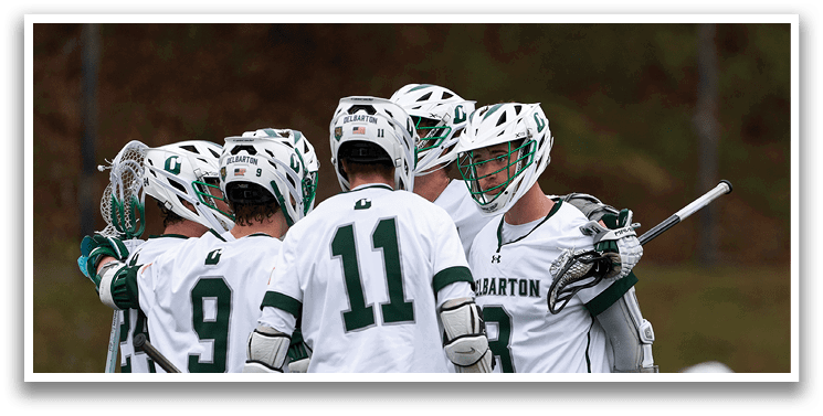 A group of hockey players wearing green and white uniforms. Description generated by AI