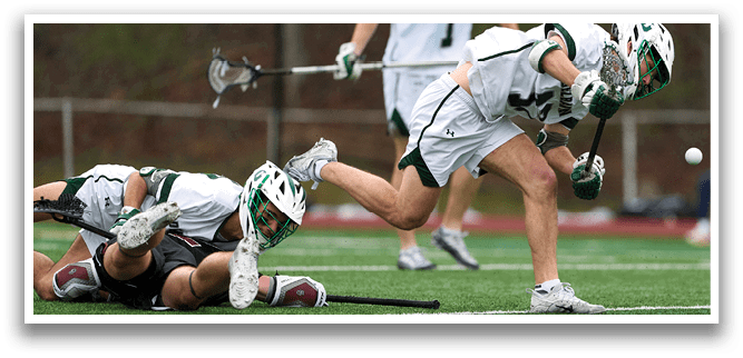 A group of people playing a game of lacrosse. Description generated by AI