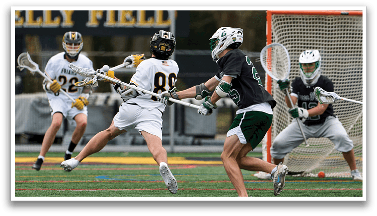 A man in a black shirt is running towards a goalie. Description generated by AI