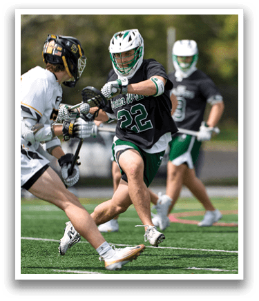 A man wearing a black shirt and green shorts is running on a field. Description generated by AI