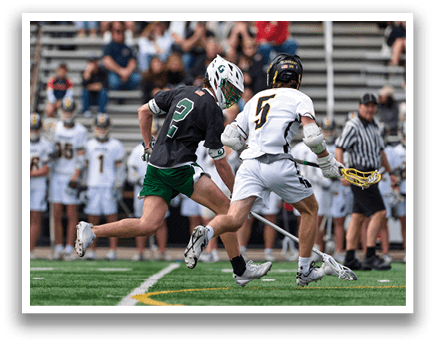 A man wearing a green and white uniform is running on a field. Description generated by AI