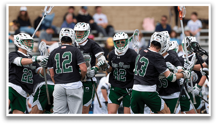 A group of lacrosse players celebrating a goal. Description generated by AI