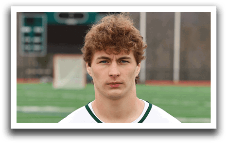 A young man wearing a Delmarion jersey. Description generated by AI