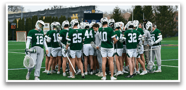 A group of people wearing green and white uniforms. Description generated by AI