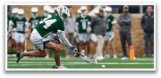 A man is playing hockey and is about to hit a ball. Description generated by AI