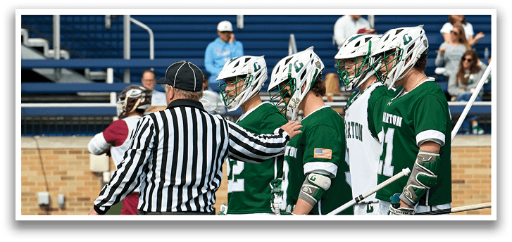 A group of men wearing green and white uniforms. Description generated by AI
