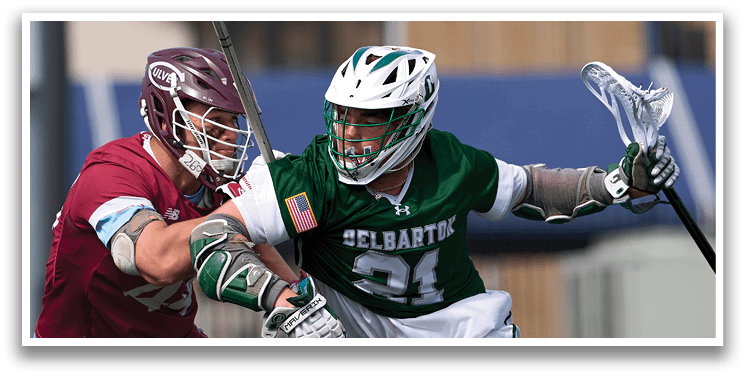 A man wearing a green and white jersey with the number 14 on it. Description generated by AI