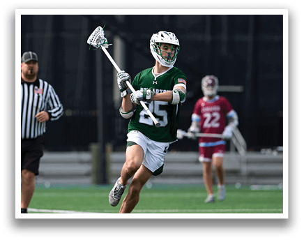 A man in a green and white uniform is running on a field. Description generated by AI