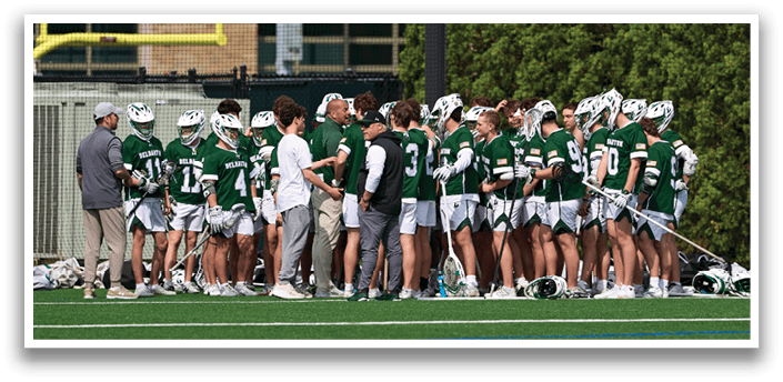 A group of people wearing green and white uniforms. Description generated by AI