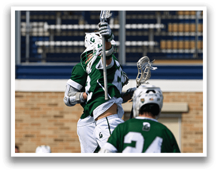 A group of men are playing lacrosse. Description generated by AI