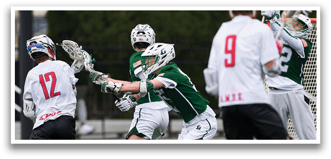 A group of men playing lacrosse. Description generated by AI
