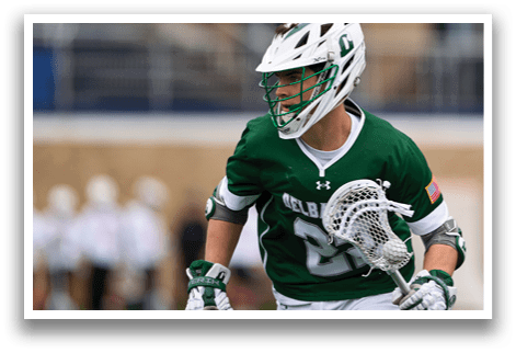 A man wearing a green and white jersey with the number 21 on it. Description generated by AI