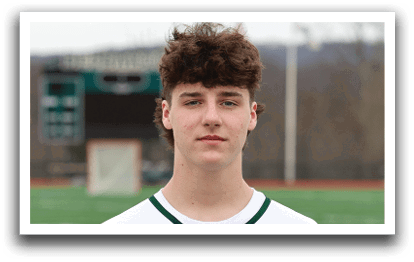 A man wearing a white and green jersey with the number 3 on it. Description generated by AI