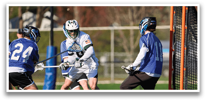 A group of people playing lacrosse. Description generated by AI