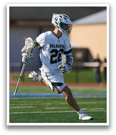 A man wearing a white jersey with the number 22 on it. Description generated by AI