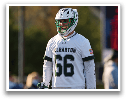 A man wearing a white and green jersey with the number 56 on it. Description generated by AI