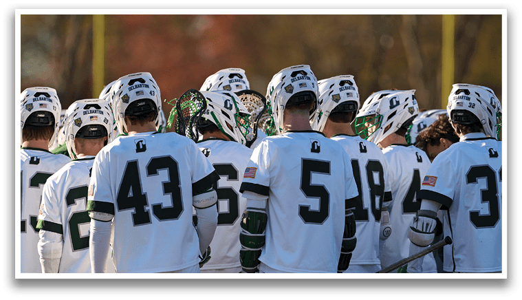 A group of people wearing white and green jerseys. Description generated by AI