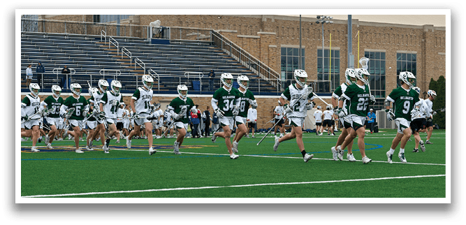 A group of people playing a game of football on a field. Description generated by AI