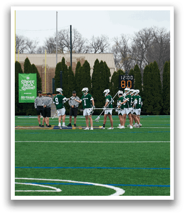 A group of people are standing on a field. Description generated by AI