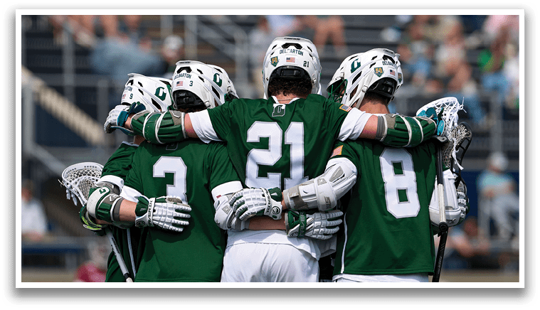 A group of men wearing green and white uniforms hugging each other. Description generated by AI