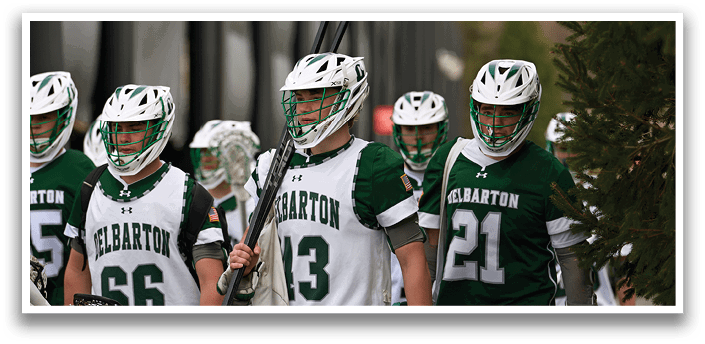 A group of people wearing green and white uniforms. Description generated by AI