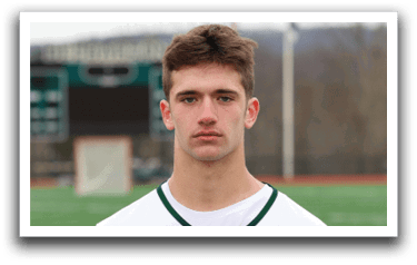 A man wearing a white and green jersey with the number 8 on it. Description generated by AI