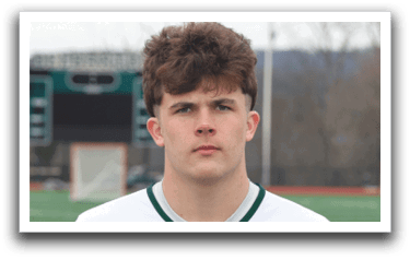 A young man wearing a Delbarton jersey. Description generated by AI