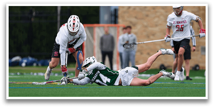 A man is sliding into a base while another man tries to tag him out. Description generated by AI