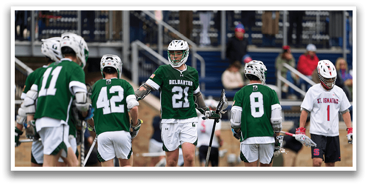 A group of men playing a game of lacrosse. Description generated by AI