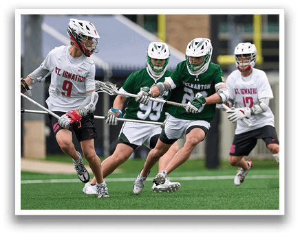 A group of men playing lacrosse. Description generated by AI