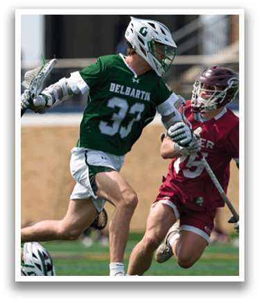 A man in a green and white uniform is running on a field. Description generated by AI