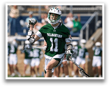 A man wearing a green and white shirt with the number 11 on it. Description generated by AI