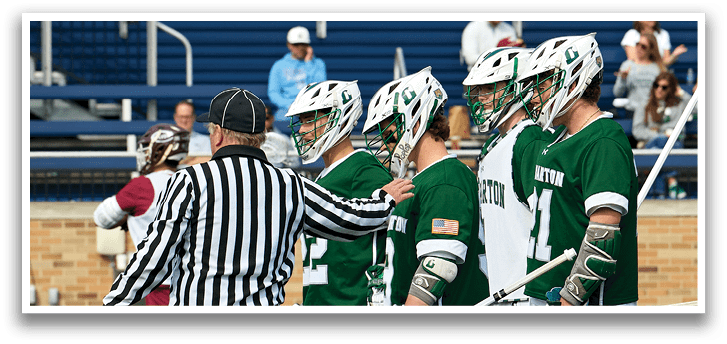 A group of men wearing green and white uniforms. Description generated by AI