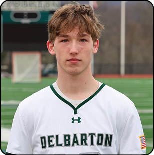 A man wearing a Delbaron jersey. Description generated by AI