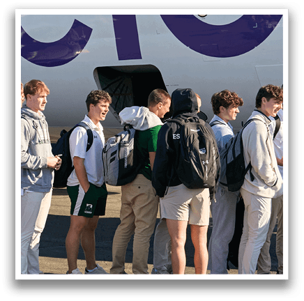 A group of people are standing in line on a tarmac. Description generated by AI