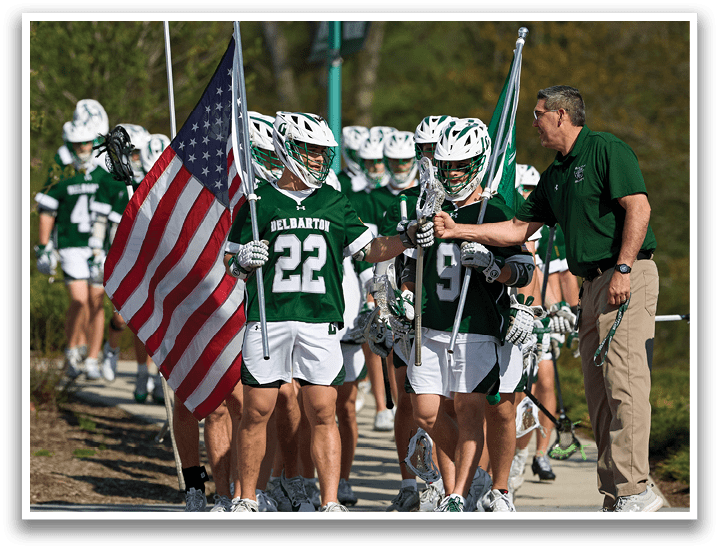 A group of people holding polo mallets and a flag. Description generated by AI