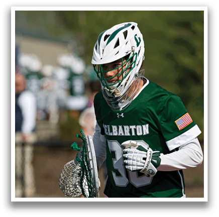 A man wearing a green and white jersey with the number 30 on it. Description generated by AI