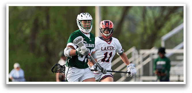 A man in a green and white uniform is running on a field. Description generated by AI