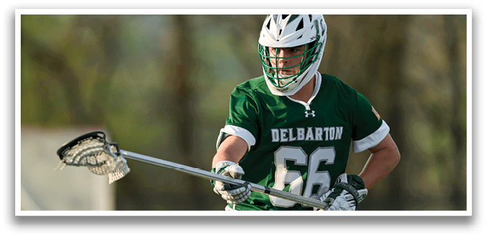 A man wearing a green and white jersey and a helmet. Description generated by AI