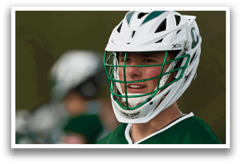 A man wearing a green and white helmet. Description generated by AI
